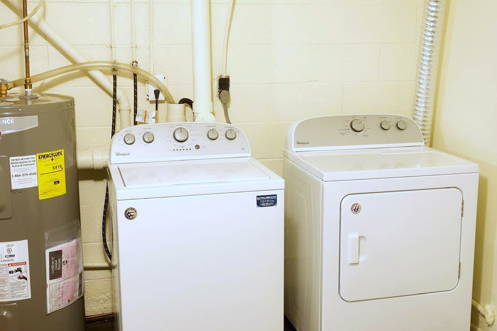 Washer and dryer with MajorMend service stickers