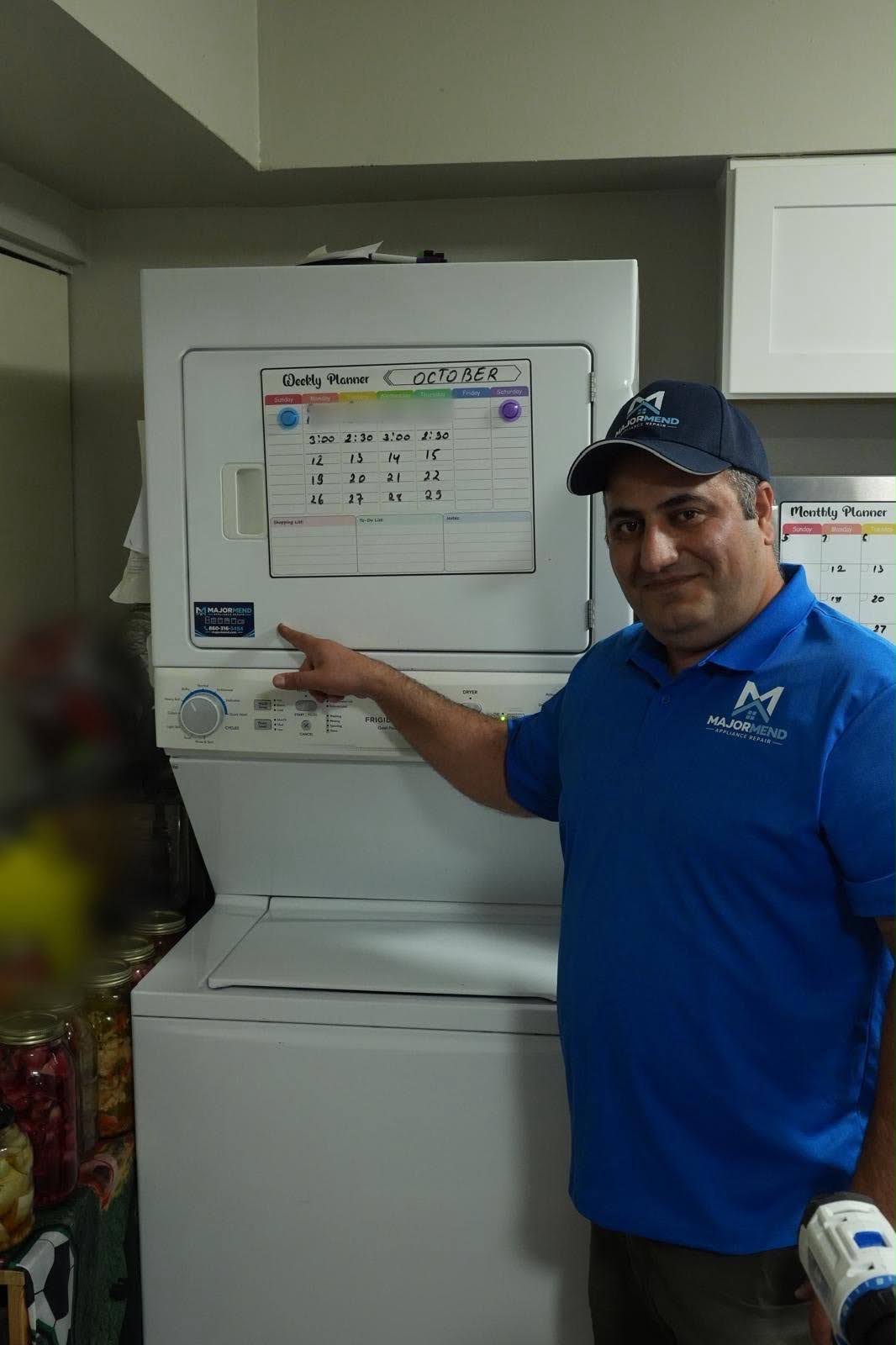 MajorMend technician beside a stacked washer and dryer